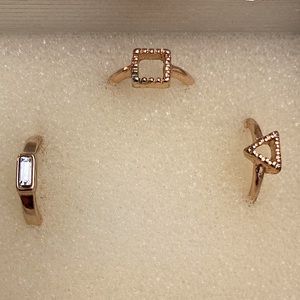 Three matching pinky rings